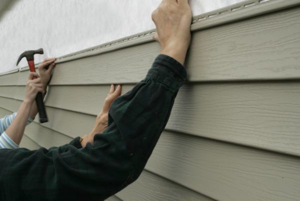 siding over stucco