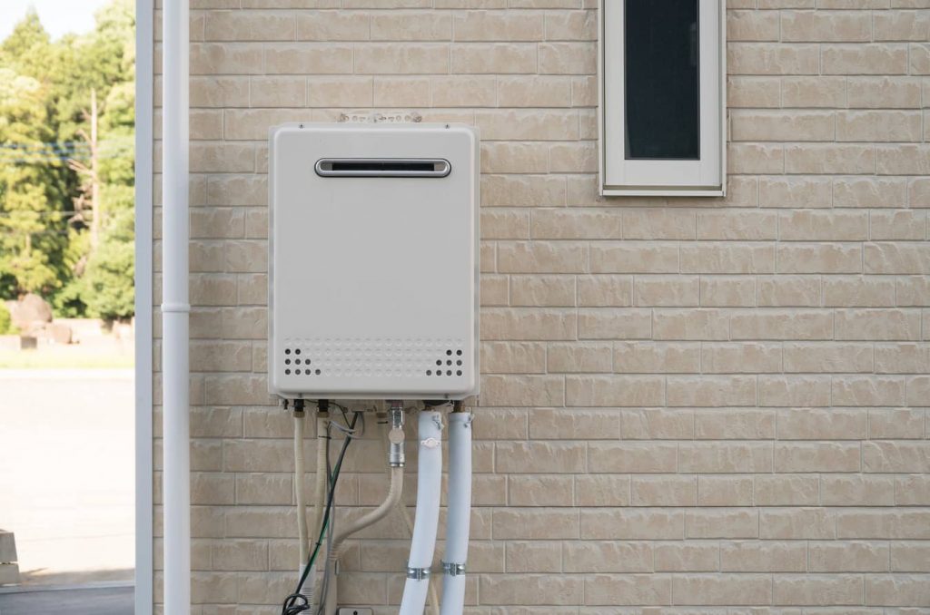 Outside wall-mounted tankless water heater.