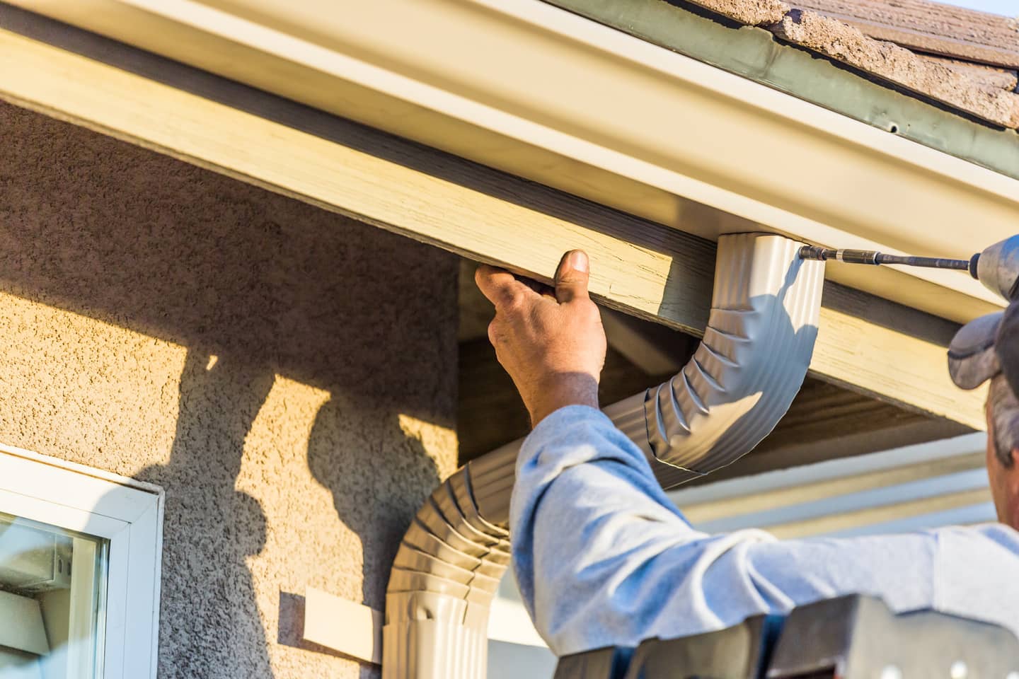 Installed aluminum gutters.