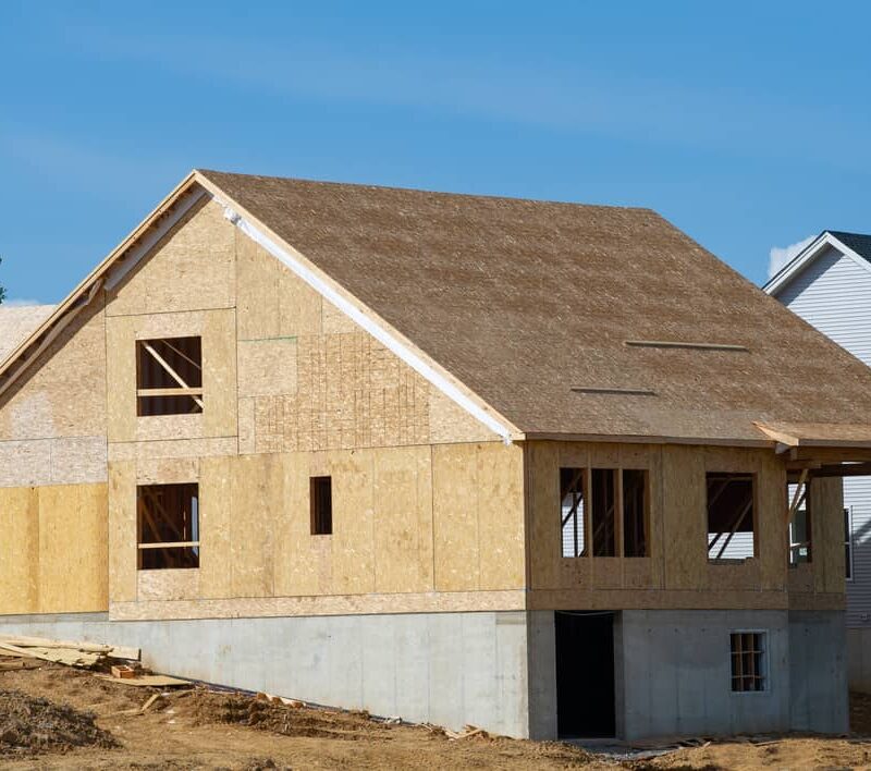 New home with exposed roof sheathing.