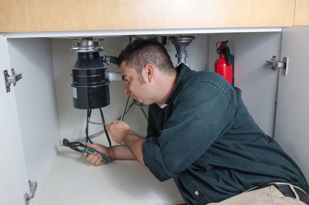 Hire a master plumber to fix your humming garbage disposal.