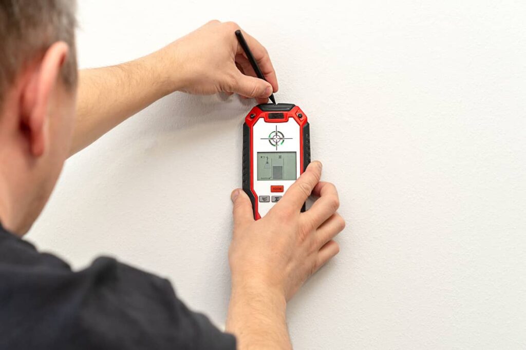 Stud finder can help find the ceiling joists. 